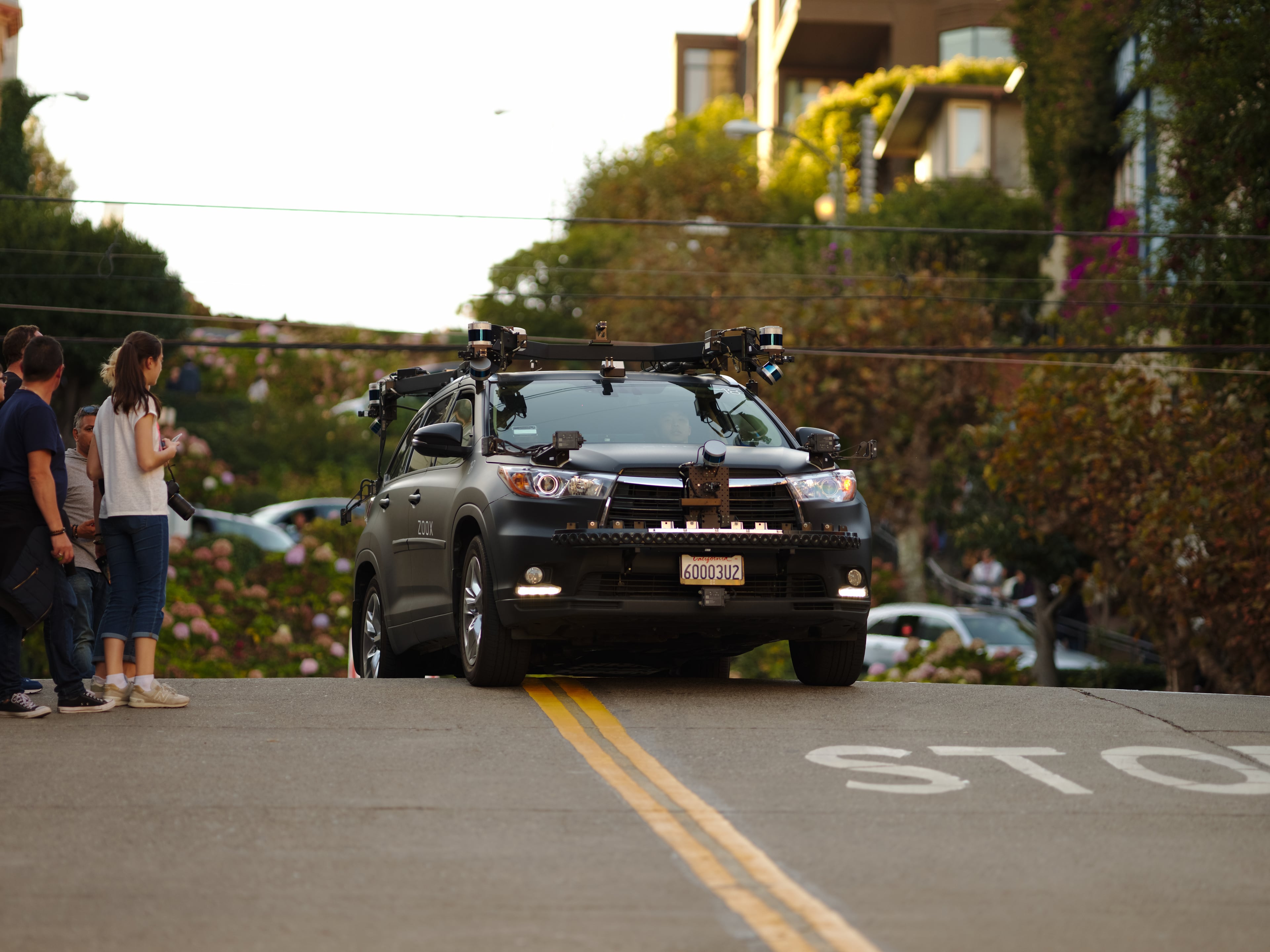 Zoox autonomous prototype vehicle driving on Lombard Street in San Francisco